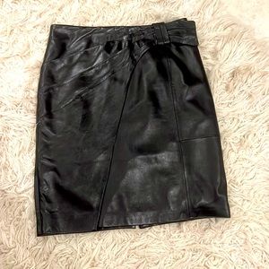Black leather skirt with pleating at waist. Fully lined. Soft leather.